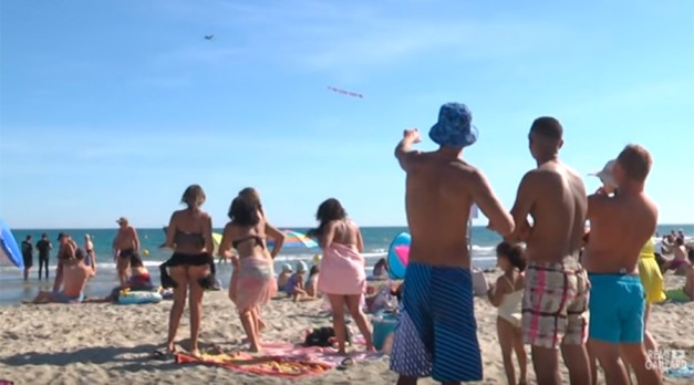 ‘Go home f***ing tourists’: Insulting plane banner targets beachgoers in France