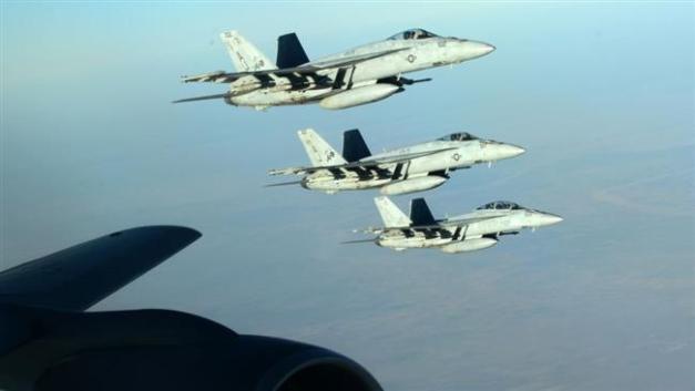 US Navy F-18E Super Hornets fly over northern Iraq as part of the US-led coalition airstrikes against Takfiri Daesh terrorist group and other targets on September 23, 2014. (Photo by AP)