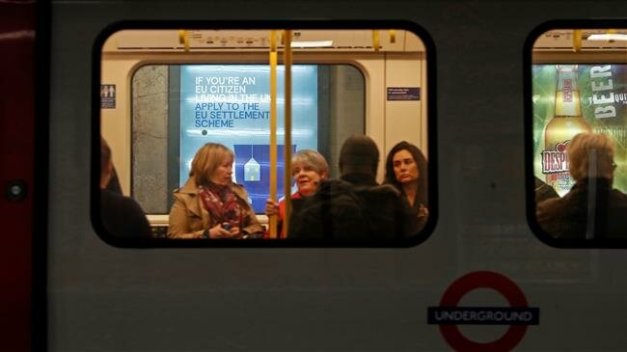People are seen on train on the London Underground. (File photo by AFP)